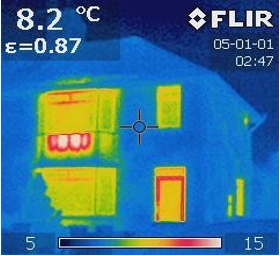 Thermal image of a house at night: the bay window and front door glow yellow and red where heat escapes, cooler walls appear blue